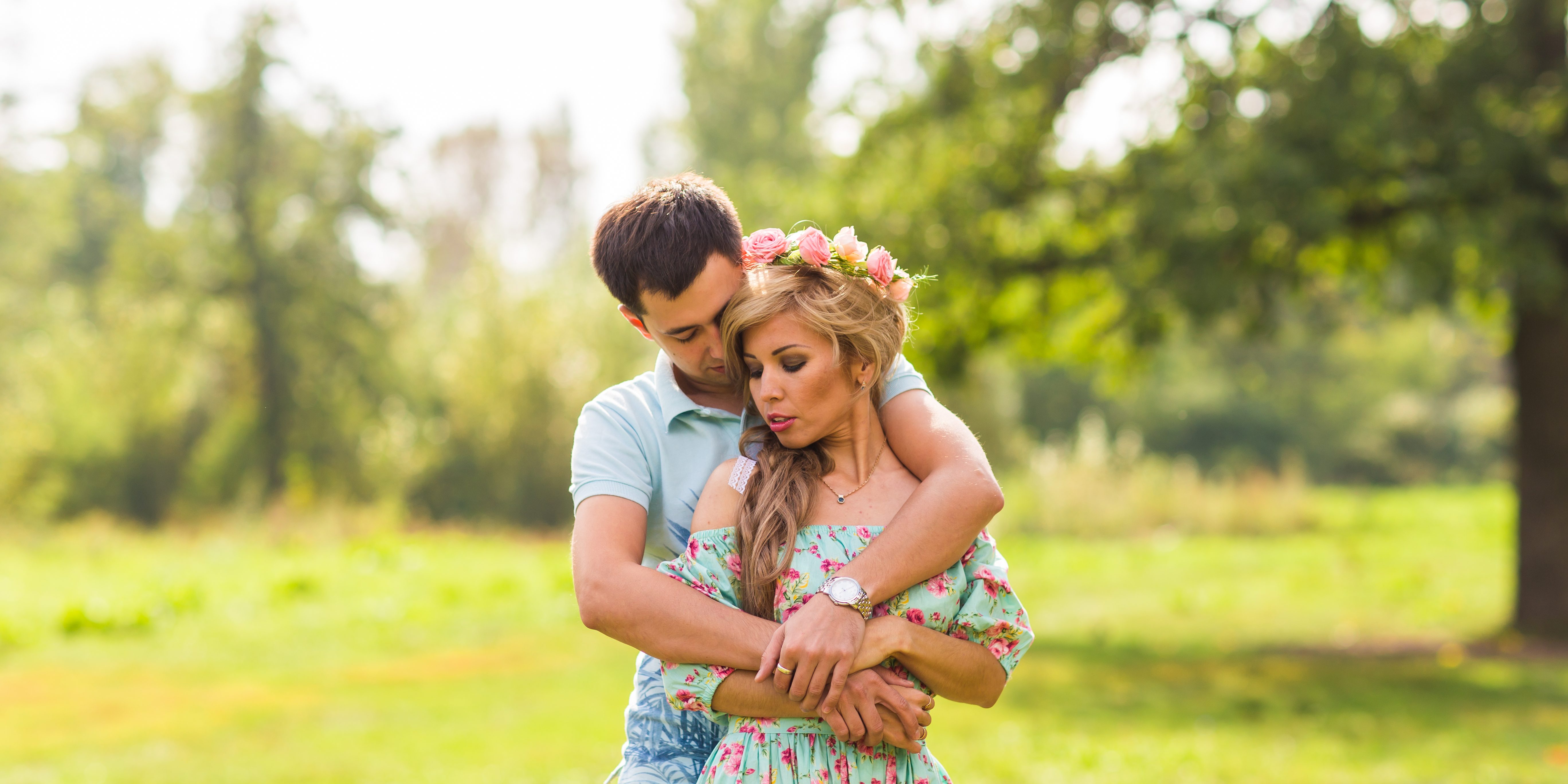 Young couple in love hug each other in nature